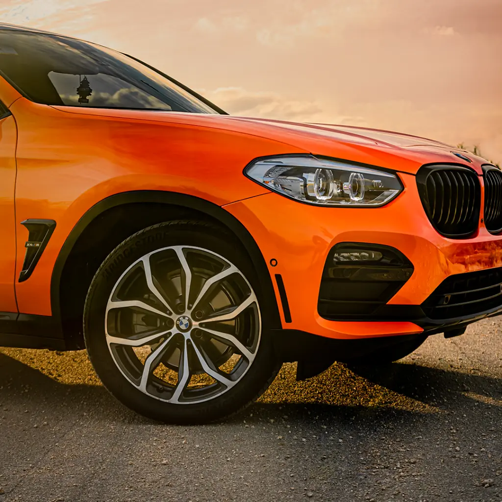 EVOLV-PPF-Electric-Tangerine-bmw-side-close-up.webp