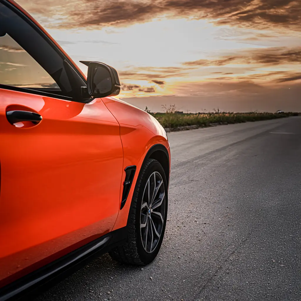 EVOLV-PPF-Electric-Tangerine-bmw-side-close-up2.webp