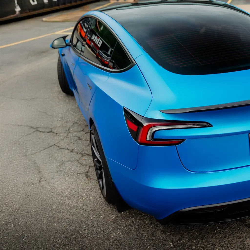 EVOLV_bomber_blue_color_ppf_tesla_closeup_back.webp