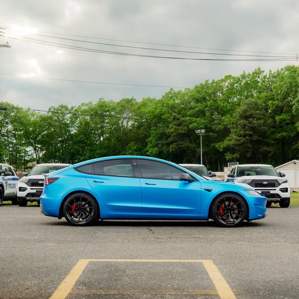 EVOLV_bomber_blue_color_ppf_tesla_sideview.webp