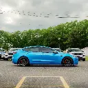 EVOLV_bomber_blue_color_ppf_tesla_sideview.webp