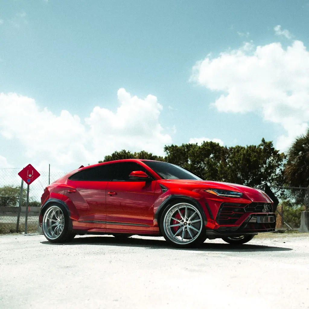 EVOLV-Super-candy-red-ppf-lamborghini-urus-sideview-front.webp