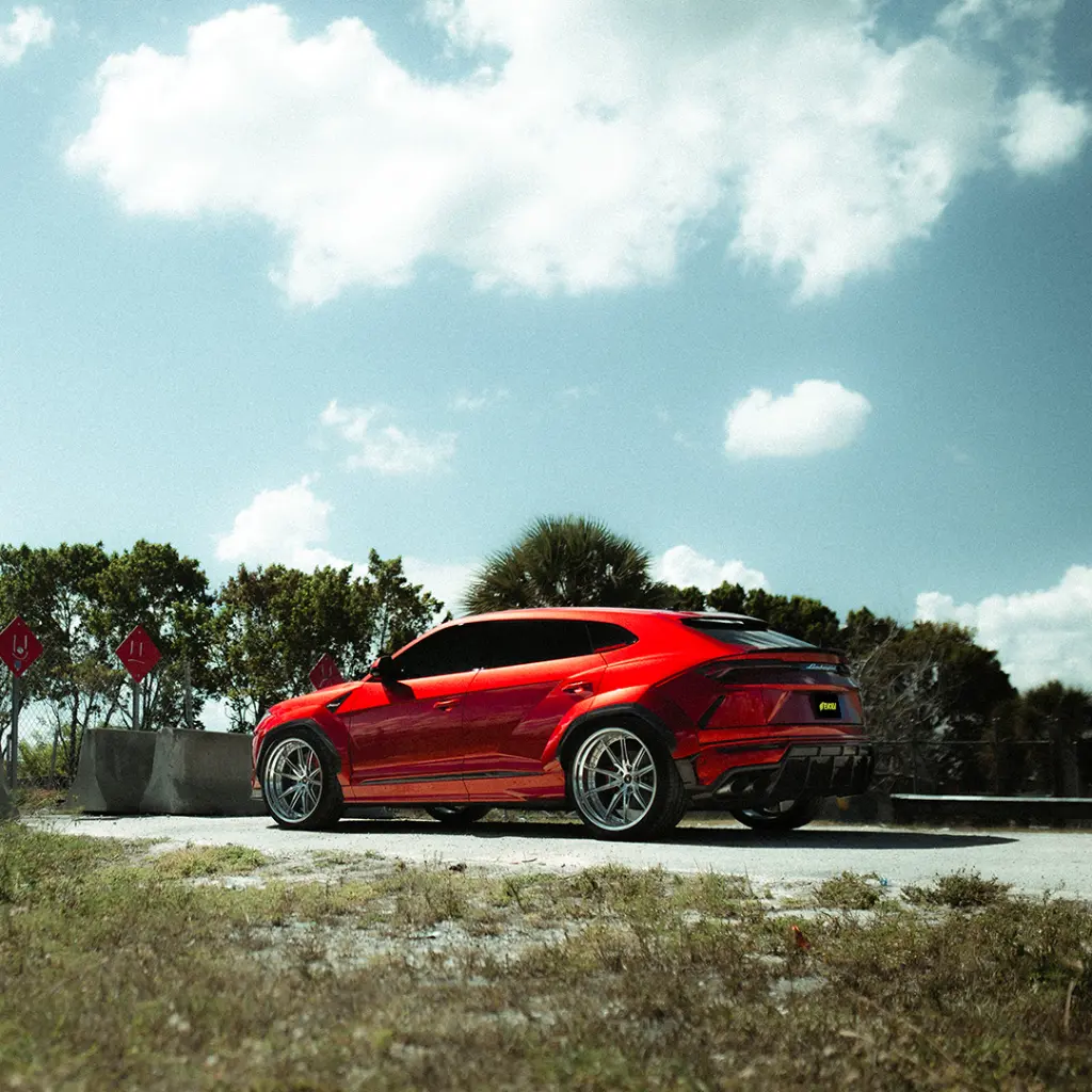 EVOLV-Super-candy-red-ppf-lamborghini-urus-sideview-back.webp