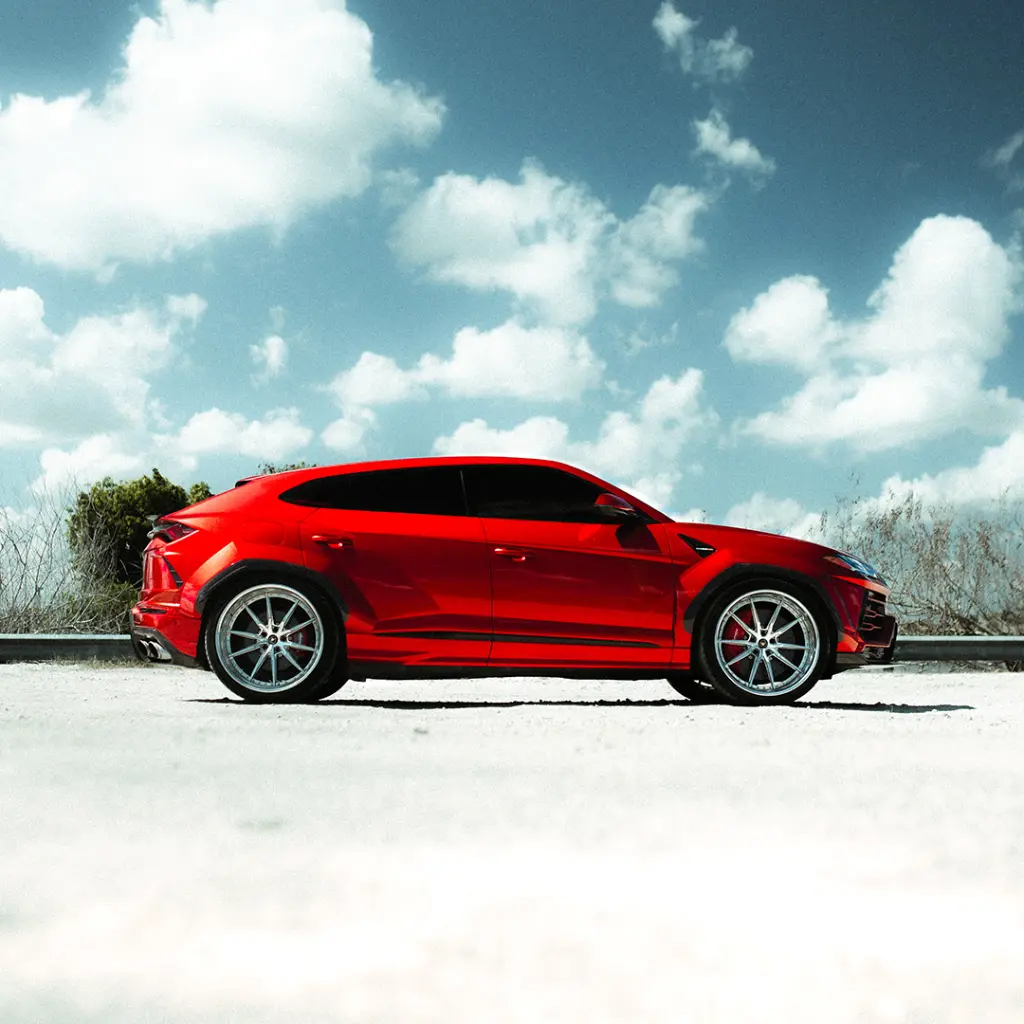 EVOLV-Super-candy-red-ppf-lamborghini-urus-sideview.webp